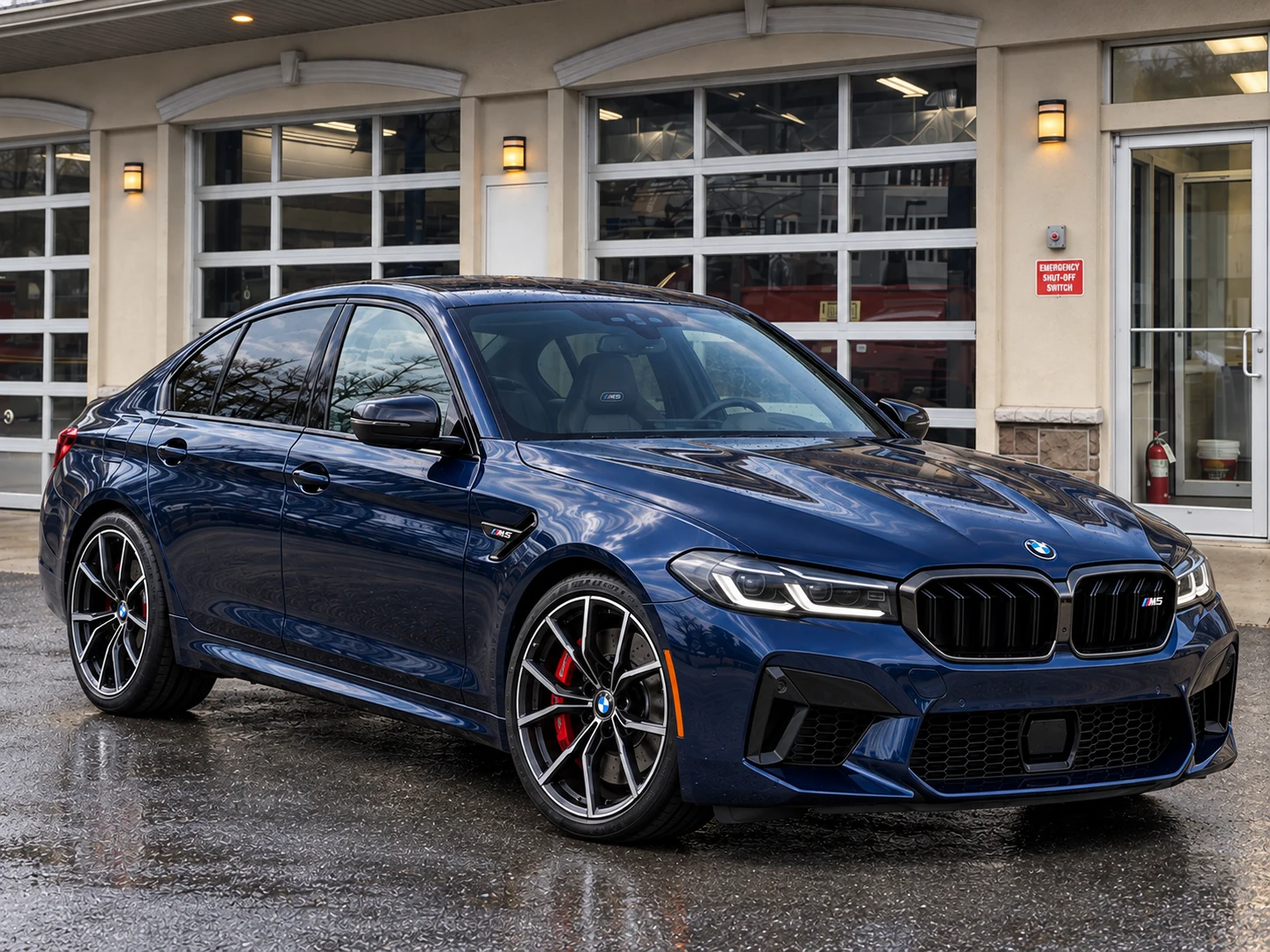 Navy BMW M5 parked outside Checkered Flag Auto Service in Midland Park