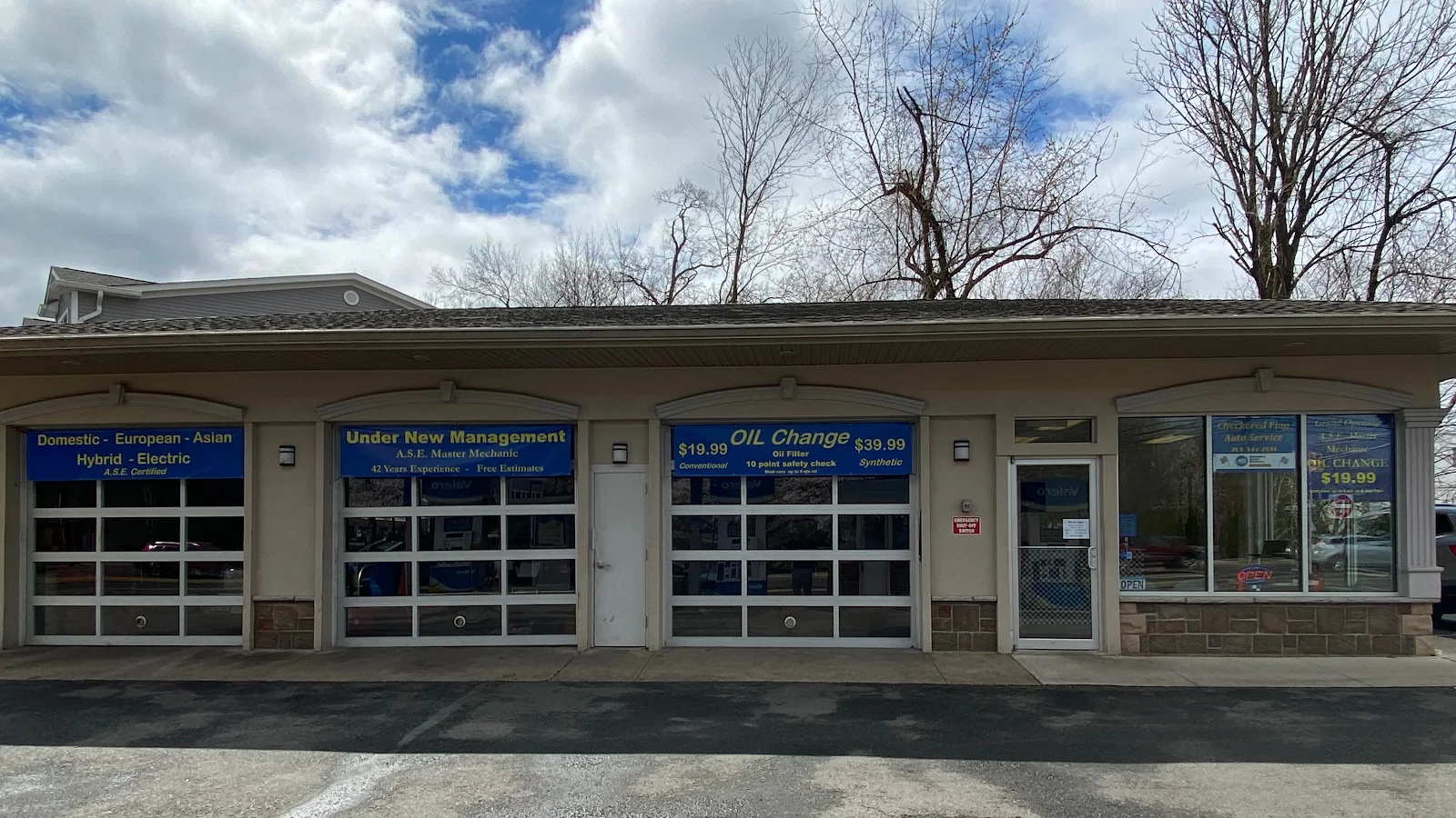 Exterior of Checkered Flag Auto Service inside the Valero Gas Station at 595 Godwin Avenue